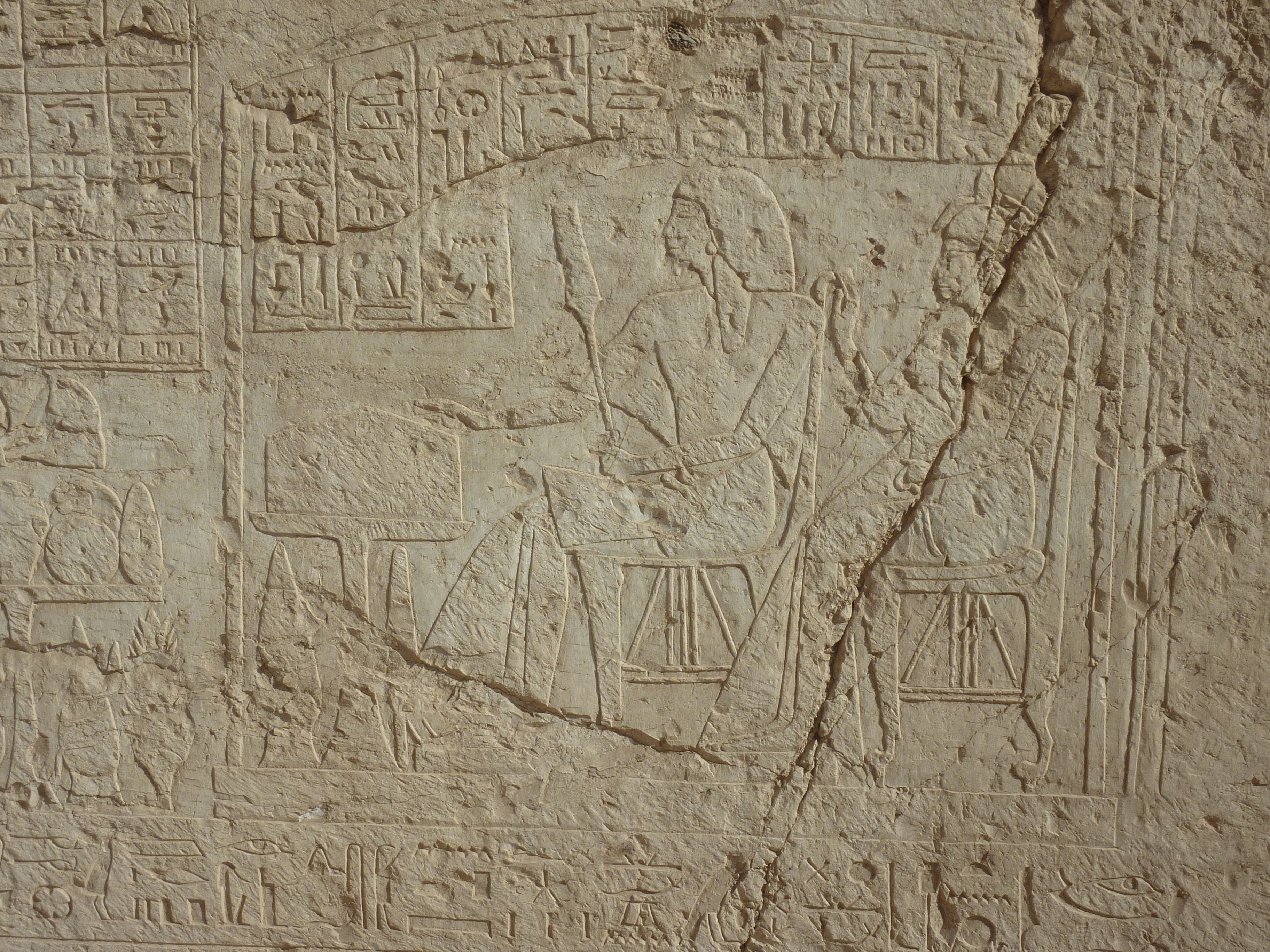 An offering scene showing a man and woman in front of an offering table