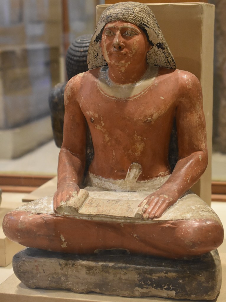 A statue of an Old Kingdom Egyptian official in scribal pose