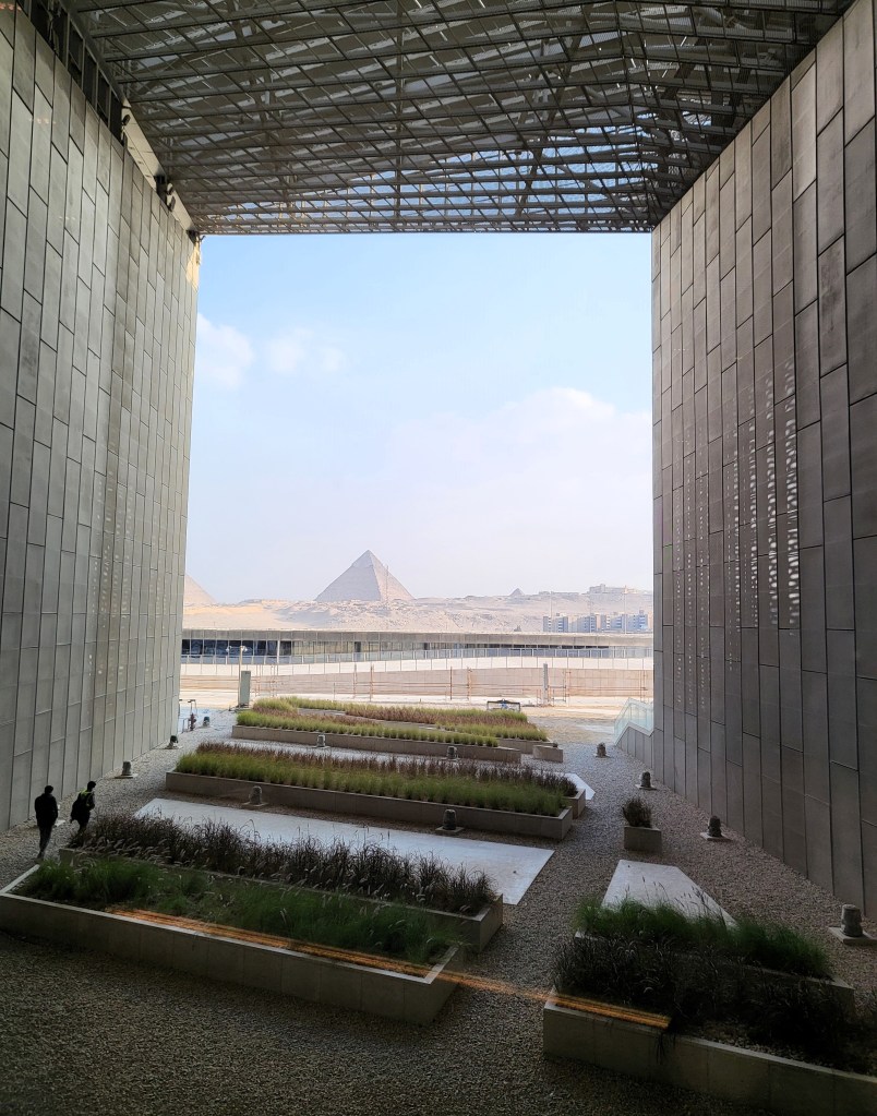 View along a large tunnel like structure towards the pyramid of Khafre at Giza.