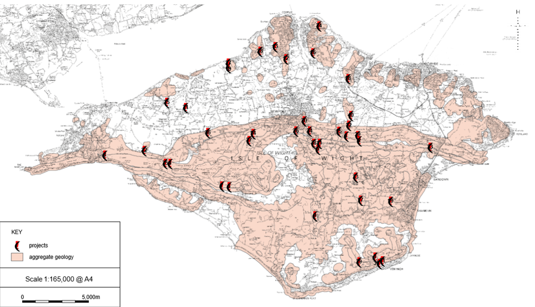A map of the Isle of Wight showing various areas across the southern half and around the north-east edge of the island, coloured pink indicating aggregates geology. Archaeological projects are indicated by crescent marks distributed across the pink areas.